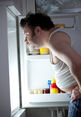 Man opening a fridge